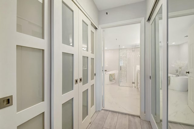 5749 Gemstone Ct Unit 404, Boynton Beach, FL 33437 - corridor with light wood-type flooring and french doors