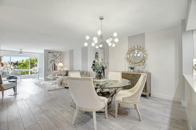 5749 Gemstone Ct Unit 404, Boynton Beach, FL 33437 - dining room with light wood finished floors, baseboards, and a chandelier