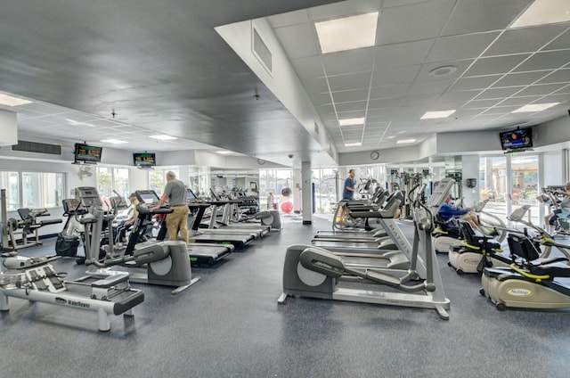 5749 Gemstone Ct Unit 404, Boynton Beach, FL 33437 - exercise room with a paneled ceiling, a healthy amount of sunlight, and visible vents