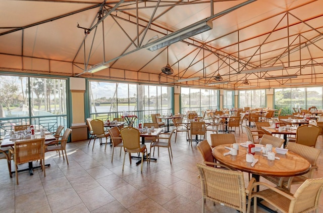 5749 Gemstone Ct Unit 404, Boynton Beach, FL 33437 - dining area with plenty of natural light, a water view, and high vaulted ceiling