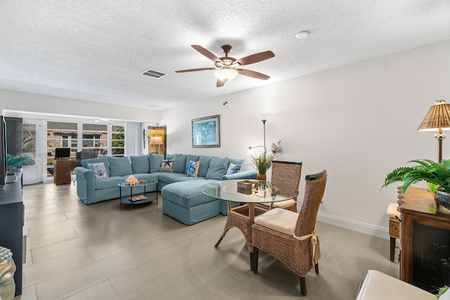 13756 Via Flora Unit A, Delray Beach, FL 33484 - living area with ceiling fan, a textured ceiling, and visible vents