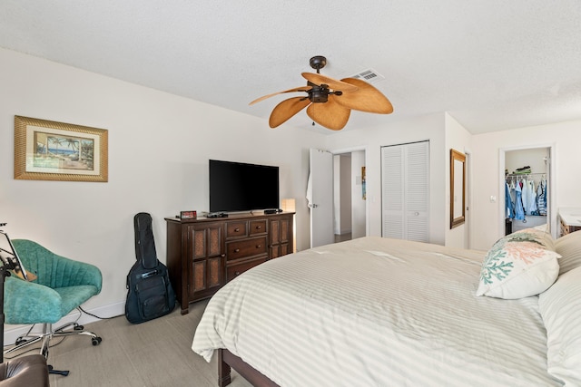 13756 Via Flora Unit A, Delray Beach, FL 33484 - bedroom with baseboards, wood finished floors, visible vents, and ceiling fan