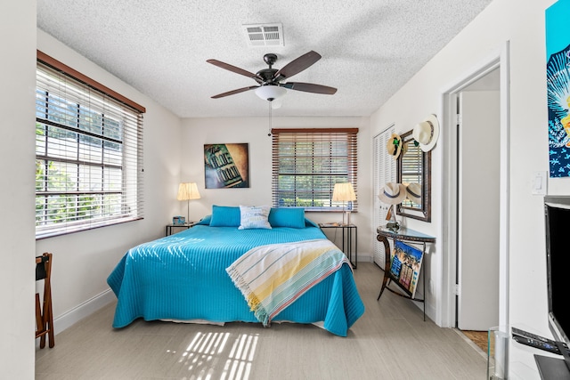 13756 Via Flora Unit A, Delray Beach, FL 33484 - bedroom with visible vents, baseboards, and multiple windows