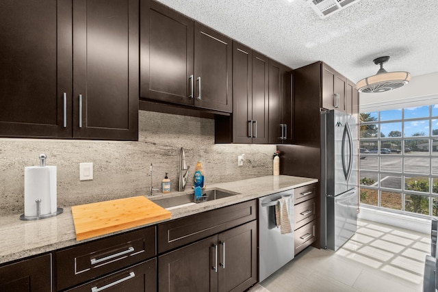 13756 Via Flora Unit A, Delray Beach, FL 33484 - kitchen with tasteful backsplash, visible vents, appliances with stainless steel finishes, and a sink