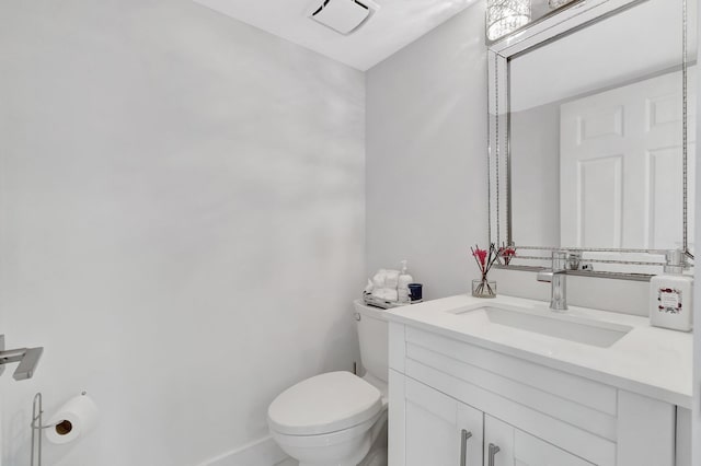 bathroom featuring toilet and vanity