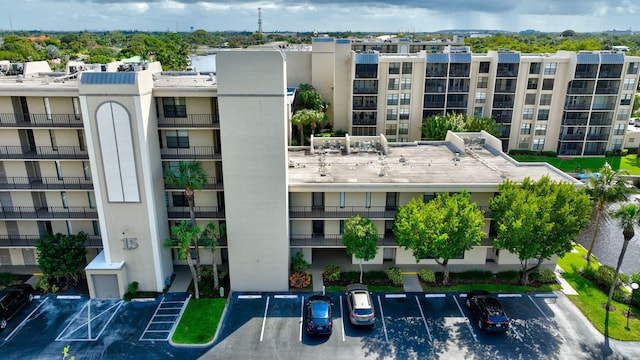 view of building exterior featuring uncovered parking