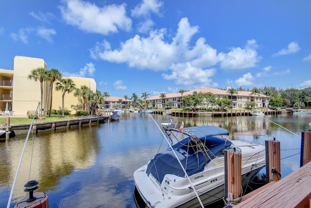 view of dock featuring a residential view and a water view