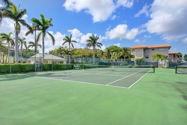 view of sport court featuring community basketball court and fence