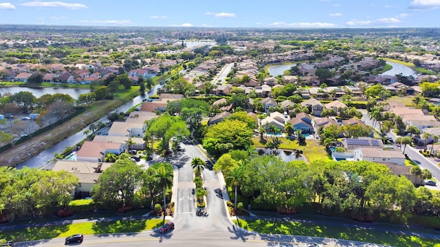 bird's eye view featuring a residential view and a water view