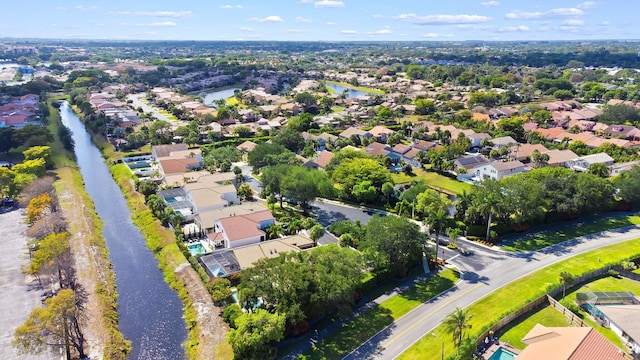 bird's eye view with a water view and a residential view