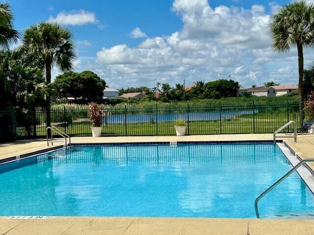 1626 Meadows Cir W Unit 1626, Boynton Beach, FL 33436 - pool featuring fence