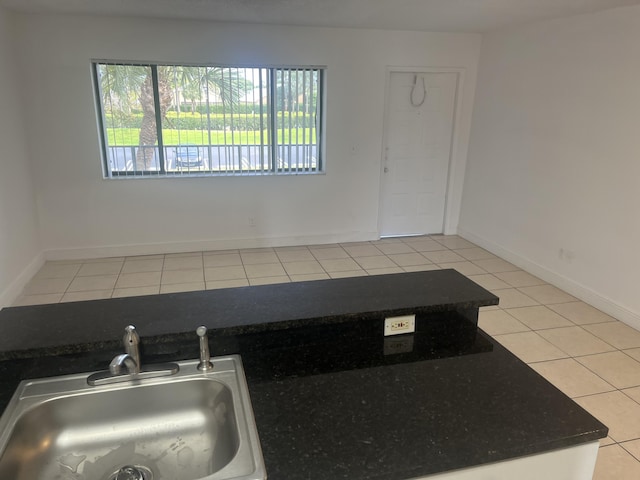1626 Meadows Cir W Unit 1626, Boynton Beach, FL 33436 - kitchen featuring baseboards, a sink, and light tile patterned floors