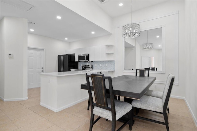dining space featuring recessed lighting, baseboards, a notable chandelier, and light tile patterned floors