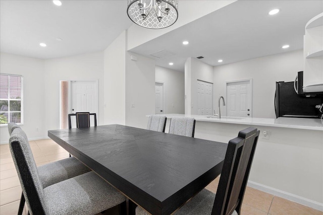 dining area with baseboards, recessed lighting, and light tile patterned floors