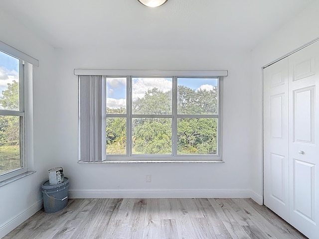 595 Vista Isles Dr Unit 1926, Sunrise, FL 33325 - unfurnished bedroom with multiple windows, light wood-style flooring, baseboards, and a closet