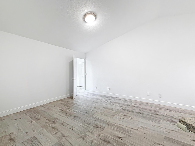 595 Vista Isles Dr Unit 1926, Sunrise, FL 33325 - empty room with light wood finished floors, baseboards, and a textured ceiling