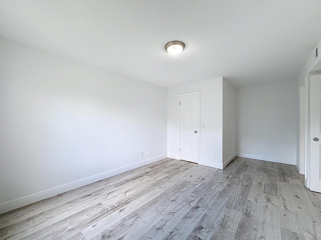 595 Vista Isles Dr Unit 1926, Sunrise, FL 33325 - unfurnished bedroom featuring light wood-type flooring and baseboards