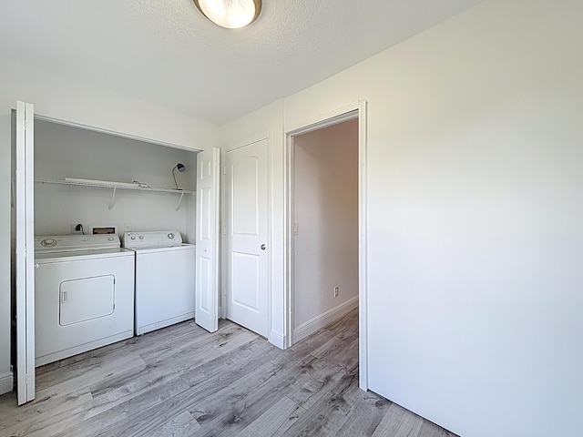 595 Vista Isles Dr Unit 1926, Sunrise, FL 33325 - laundry area featuring washer and dryer, light wood-style flooring, and baseboards
