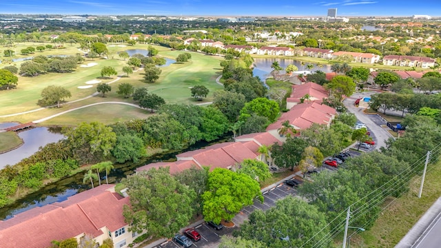 595 Vista Isles Dr Unit 1926, Sunrise, FL 33325 - aerial view of residential area featuring a golf course, a large body of water, and a tree filled landscape