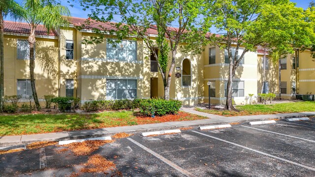 595 Vista Isles Dr Unit 1926, Sunrise, FL 33325 - view of building exterior with uncovered parking