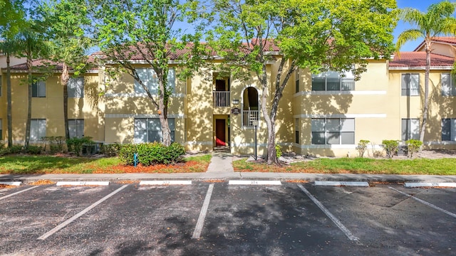595 Vista Isles Dr Unit 1926, Sunrise, FL 33325 - view of building exterior with uncovered parking
