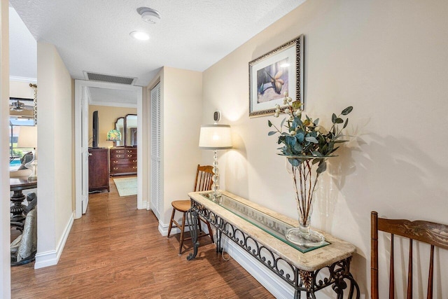 11217 Island Lakes Ln, Boca Raton, FL 33498 - hall with wood finished floors, baseboards, and a textured ceiling