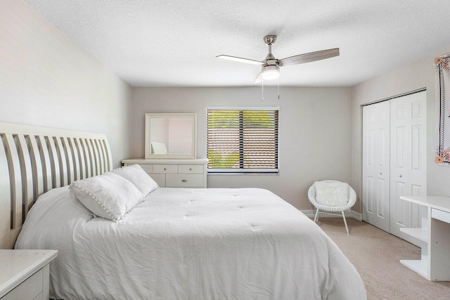 11217 Island Lakes Ln, Boca Raton, FL 33498 - bedroom with light colored carpet, a closet, ceiling fan, and a textured ceiling
