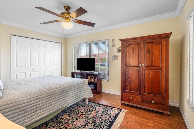 11217 Island Lakes Ln, Boca Raton, FL 33498 - bedroom with wood finished floors, crown molding, baseboards, a closet, and a ceiling fan