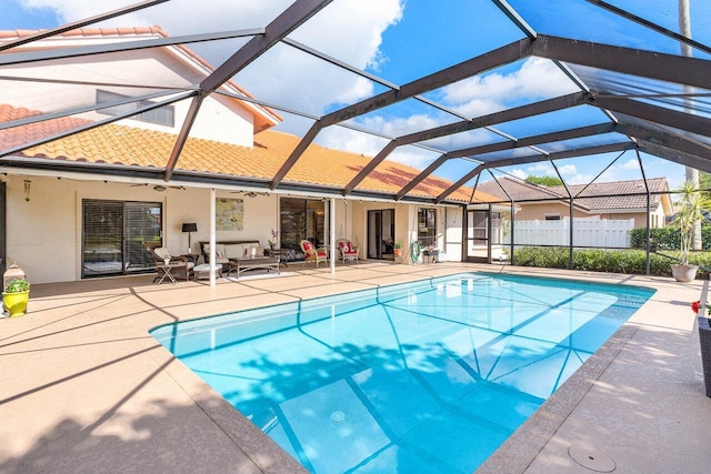 11217 Island Lakes Ln, Boca Raton, FL 33498 - view of swimming pool featuring a patio area, a ceiling fan, an outdoor living space, and glass enclosure