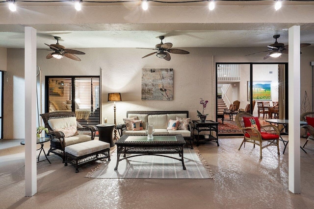 11217 Island Lakes Ln, Boca Raton, FL 33498 - living room featuring ceiling fan, track lighting, and concrete flooring