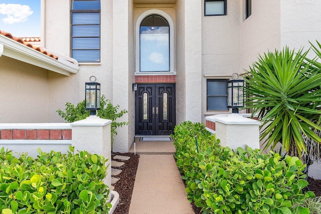 11217 Island Lakes Ln, Boca Raton, FL 33498 - doorway to property with stucco siding