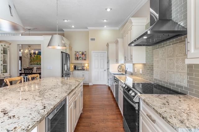 11217 Island Lakes Ln, Boca Raton, FL 33498 - kitchen with appliances with stainless steel finishes, wall chimney range hood, wine cooler, a chandelier, and dark wood-type flooring