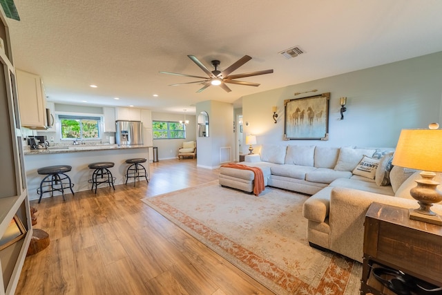 2675 SW 24th Ave, Okeechobee, FL 34974 - living room with light wood-style flooring, ceiling fan, recessed lighting, and baseboards