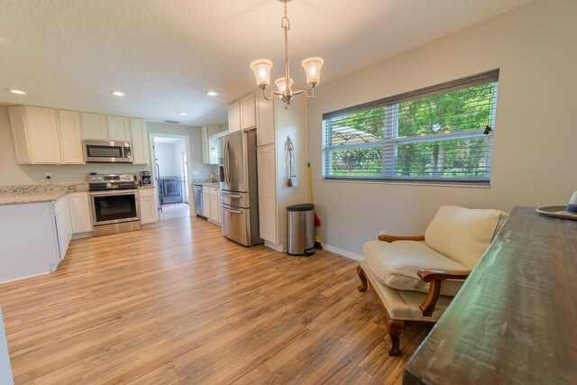 2675 SW 24th Ave, Okeechobee, FL 34974 - kitchen featuring appliances with stainless steel finishes, light wood-style floors, baseboards, recessed lighting, and white cabinetry