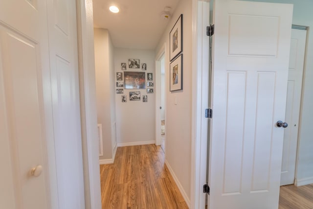 2675 SW 24th Ave, Okeechobee, FL 34974 - corridor featuring light wood-style flooring and baseboards