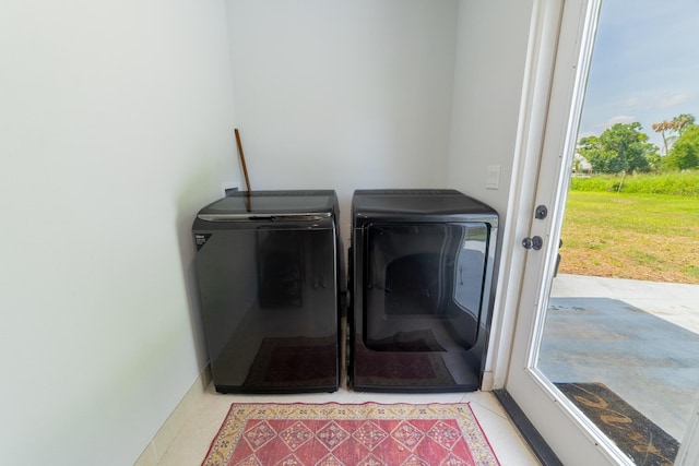 2675 SW 24th Ave, Okeechobee, FL 34974 - laundry room with washing machine and clothes dryer and light tile patterned floors