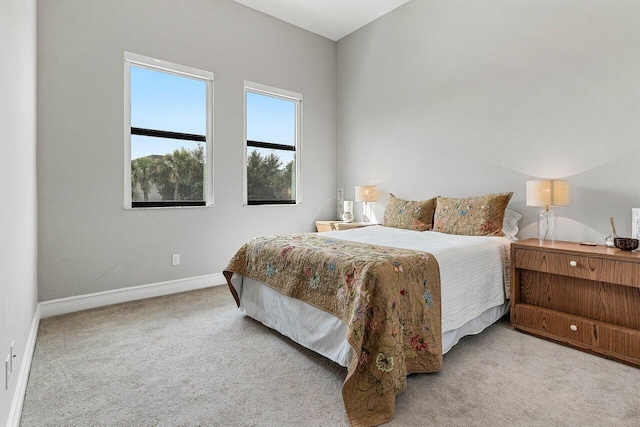 carpeted bedroom with baseboards