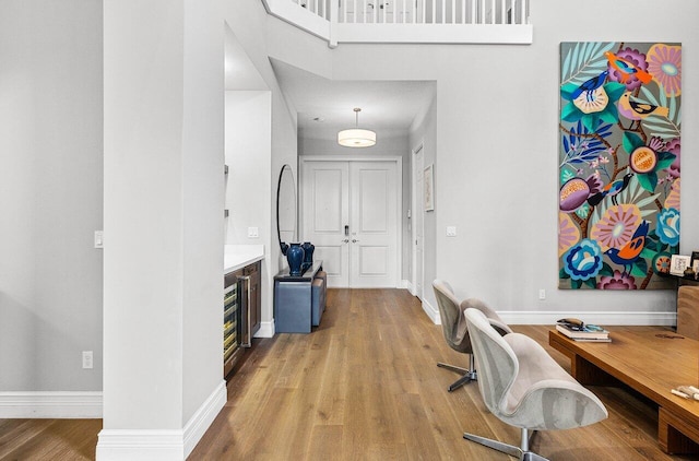 interior space with baseboards and light wood-style flooring