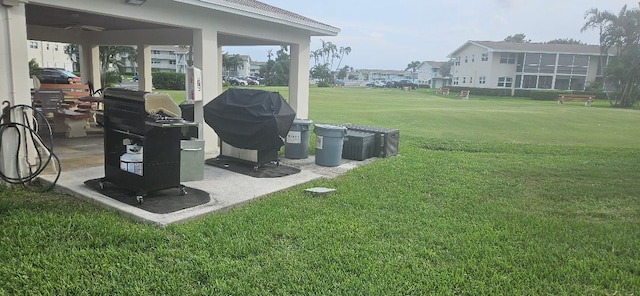 880 Horizons W Unit 112, Boynton Beach, FL 33435 - view of yard featuring a ceiling fan and a patio area