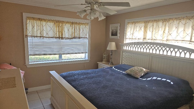 880 Horizons W Unit 112, Boynton Beach, FL 33435 - bedroom featuring light tile patterned flooring, a ceiling fan, ornamental molding, and baseboards