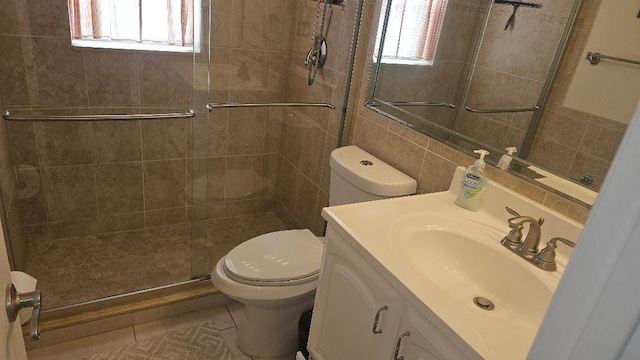 880 Horizons W Unit 112, Boynton Beach, FL 33435 - bathroom with toilet, a stall shower, tile walls, and vanity