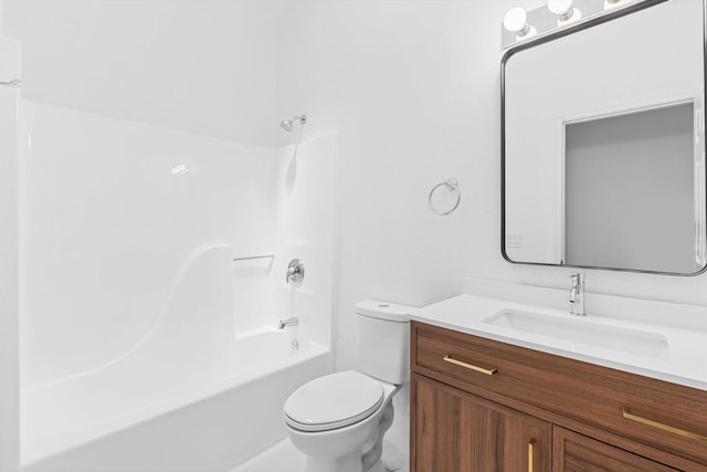 bathroom featuring bathing tub / shower combination, vanity, and toilet