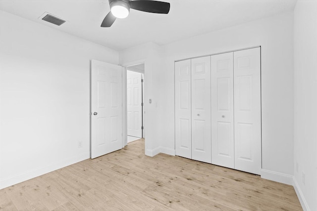 unfurnished bedroom featuring light wood-type flooring, visible vents, and baseboards
