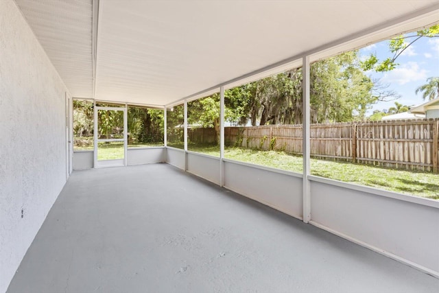 unfurnished sunroom featuring a wealth of natural light