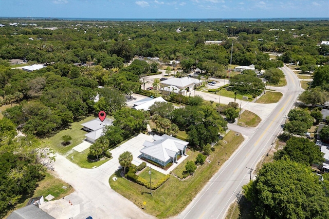 bird's eye view featuring a forest view