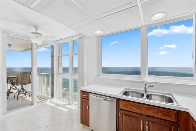 1370 S Ocean Blvd Unit 1808, Pompano Beach, FL 33062 - kitchen featuring stainless steel dishwasher, a water view, light tile patterned floors, light countertops, and a ceiling fan