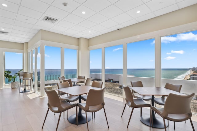 1370 S Ocean Blvd Unit 1808, Pompano Beach, FL 33062 - sunroom / solarium featuring a drop ceiling, a water view, and wood finished floors