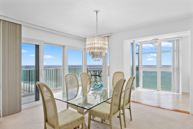 1370 S Ocean Blvd Unit 1808, Pompano Beach, FL 33062 - dining room with a water view, a chandelier, and light carpet