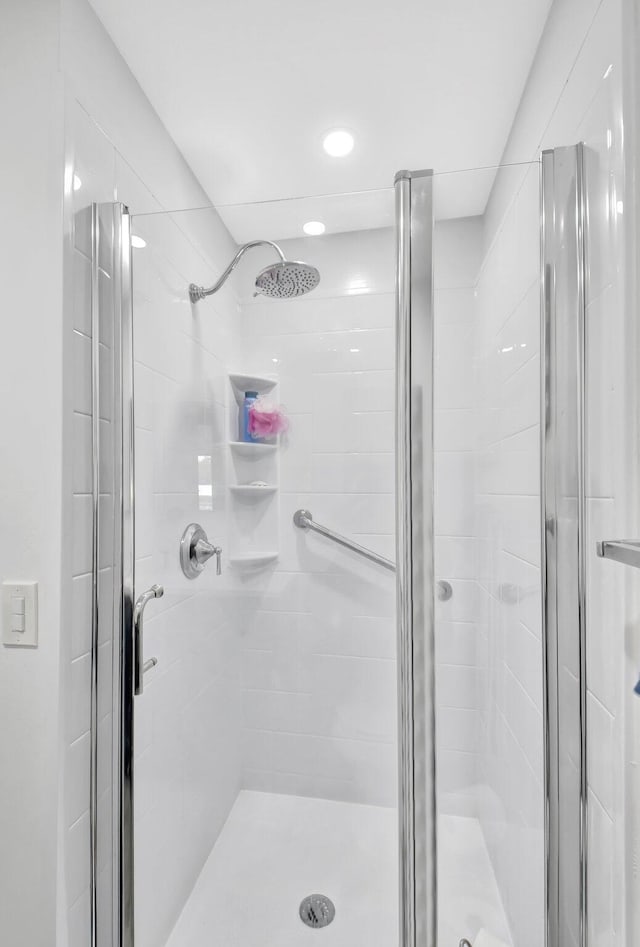 bathroom featuring a shower stall and recessed lighting