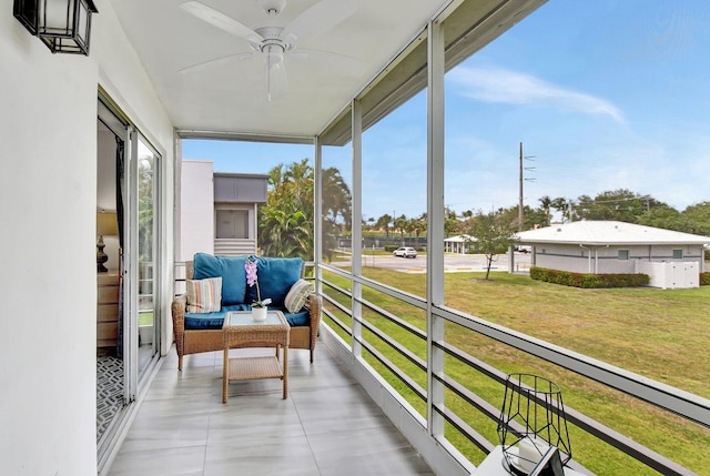 sunroom with a ceiling fan